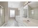 Bright bathroom featuring double sinks, a glass-enclosed shower, and great natural light from the window at 4071 Cottage Oaks Dr # 3, Acworth, GA 30101