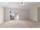 This bedroom features a sliding glass door, ceiling fan and neutral carpet at 4071 Cottage Oaks Dr # 3, Acworth, GA 30101