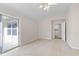 This bedroom features a sliding glass door that provides access to the exterior of the home at 4071 Cottage Oaks Dr # 3, Acworth, GA 30101