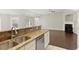 Stylish kitchen flows seamlessly to the living room, features granite counters, and modern appliances at 4071 Cottage Oaks Dr # 3, Acworth, GA 30101