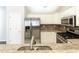 Modern kitchen features stainless steel appliances and granite countertops, offering a chef's dream at 4071 Cottage Oaks Dr # 3, Acworth, GA 30101