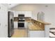 Well-lit kitchen features stainless steel appliances and granite countertops at 4071 Cottage Oaks Dr # 3, Acworth, GA 30101