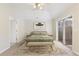 Bright bedroom features a ceiling fan, sliding glass door and decorative rug at 4071 Cottage Oaks Dr # 3, Acworth, GA 30101