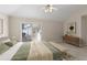 Bright bedroom features a ceiling fan, sliding glass door and decorative rug at 4071 Cottage Oaks Dr # 3, Acworth, GA 30101