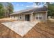 View of backyard concrete patio, offering space for outdoor seating and entertaining at 2279 Perch Sw Way, Marietta, GA 30008