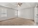 Large bedroom with carpet, neutral walls, and tray ceilings at 2279 Perch Sw Way, Marietta, GA 30008