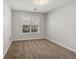 Cozy bedroom with neutral walls, plush carpeting, and a window providing natural light at 2279 Perch Sw Way, Marietta, GA 30008