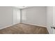 Bright bedroom with plush carpeting, double closet, and a window at 2279 Perch Sw Way, Marietta, GA 30008