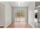 Bright dining area featuring wood floors, sliding glass doors, and a modern light fixture at 2279 Perch Sw Way, Marietta, GA 30008