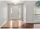 Inviting foyer showcasing wood floors and a front door with sidelights, leading to other rooms at 2279 Perch Sw Way, Marietta, GA 30008