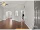 Spacious living room with wood floors, arched doorways, and open access to the kitchen and dining area at 2279 Perch Sw Way, Marietta, GA 30008