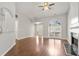 Bright living room showcasing wood floors, a fireplace, a large arched window, and neutral gray walls at 2279 Perch Sw Way, Marietta, GA 30008