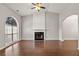 Bright living room featuring wood floors, a fireplace, a large window, and neutral gray walls at 2279 Perch Sw Way, Marietta, GA 30008