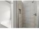 The tiled shower features modern fixtures and ample space at 2279 Perch Sw Way, Marietta, GA 30008