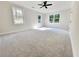 Large bedroom with carpeted floors, natural light, and neutral walls at 2295 Rocky Mountain Ne Rd, Marietta, GA 30066