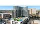 Stunning aerial view of a modern high-rise building with rooftop amenities including a pool and green spaces at 2425 Peachtree Ne Rd # 1705, Atlanta, GA 30305