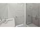 Modern bathroom features a sleek vanity, toilet, and a glass-enclosed shower with stylish fixtures at 2425 Peachtree Ne Rd # 1705, Atlanta, GA 30305