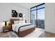 Bright bedroom features a large window with a view, stylish furniture, and modern decor at 2425 Peachtree Ne Rd # 1705, Atlanta, GA 30305