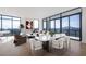 Living room and dining area with floor-to-ceiling windows showcasing a stunning city skyline at 2425 Peachtree Ne Rd # 1705, Atlanta, GA 30305