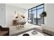 Contemporary office space with a large window offering natural light and scenic views at 2425 Peachtree Ne Rd # 1705, Atlanta, GA 30305