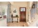 Inviting entryway with hardwood floors, a wood door, and staircase at 243 Sterling St, Decatur, GA 30030
