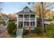 Charming two-story home with a double front porch, a yard, and beautiful landscaping at 243 Sterling St, Decatur, GA 30030