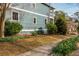 Exterior of a blue two-story house with manicured landscaping and a sidewalk at 243 Sterling St, Decatur, GA 30030