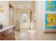 Light-filled hallway with a beautiful dresser and hardwood floors at 243 Sterling St, Decatur, GA 30030