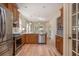 Spacious kitchen featuring stainless steel appliances, wood cabinets, and hardwood floors at 243 Sterling St, Decatur, GA 30030