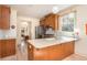Bright kitchen with stainless steel appliances, wood cabinets, and kitchen island with seating at 243 Sterling St, Decatur, GA 30030