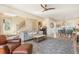 Open-concept living room with a gray sofa, a ceiling fan, and hardwood floors at 243 Sterling St, Decatur, GA 30030