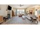Spacious living room featuring a fireplace, large windows, and hardwood floors at 243 Sterling St, Decatur, GA 30030