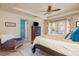 Main bedroom features a tray ceiling, ceiling fan, and french doors to the exterior at 243 Sterling St, Decatur, GA 30030