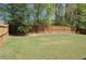 Backyard featuring a full wooden fence and a lawn at 5250 Fieldgate Ridge Dr, Cumming, GA 30028