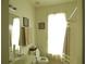 Well-lit bathroom with framed art, window, and shower/tub combo at 5250 Fieldgate Ridge Dr, Cumming, GA 30028