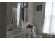 Bathroom with sink and toilet featuring coordinated towel sets, wall art and natural light from the window at 5250 Fieldgate Ridge Dr, Cumming, GA 30028