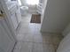 Neutral bathroom with tiled floor and white vanity at 5250 Fieldgate Ridge Dr, Cumming, GA 30028