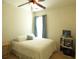 Cozy bedroom featuring a comfortable bed, simple decor, and a ceiling fan for added comfort at 5250 Fieldgate Ridge Dr, Cumming, GA 30028