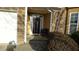 Inviting front door view shows well-manicured landscaping and brick facade at 5250 Fieldgate Ridge Dr, Cumming, GA 30028