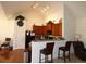 Spacious kitchen featuring dark wood cabinets, stainless steel appliances, and a breakfast bar at 5250 Fieldgate Ridge Dr, Cumming, GA 30028