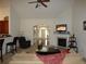 Open-concept living room features a fireplace, vaulted ceilings, and seamless flow to the kitchen and entry at 5250 Fieldgate Ridge Dr, Cumming, GA 30028