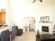 Open-concept living room features a fireplace, vaulted ceilings, and seamless flow to the kitchen and entry at 5250 Fieldgate Ridge Dr, Cumming, GA 30028