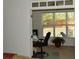 Office space with natural light with a chair, computer, and leafy potted plant at 5250 Fieldgate Ridge Dr, Cumming, GA 30028