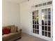 Bright office with french doors providing natural light, adjacent sitting area at 5250 Fieldgate Ridge Dr, Cumming, GA 30028