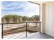 Outdoor balcony overlooking a landscaped yard and street at 7230 Summit Pl, Alpharetta, GA 30009