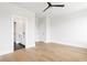 Bright bedroom featuring hardwood floors, an ensuite bathroom and walk-in closet at 7230 Summit Pl, Alpharetta, GA 30009