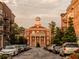 Charming street view of traditional brick buildings with string lights overhead creating an inviting atmosphere at 7230 Summit Pl, Alpharetta, GA 30009