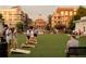 Community lawn with residents participating in outdoor games near residential buildings at 7230 Summit Pl, Alpharetta, GA 30009