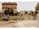 Beautiful fountain area with residential buildings and people enjoying the outdoors at 7230 Summit Pl, Alpharetta, GA 30009
