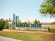 Community entrance sign with lush landscaping and modern design elements at 7230 Summit Pl, Alpharetta, GA 30009